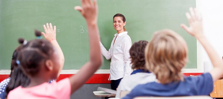 Teacher at chalkboard